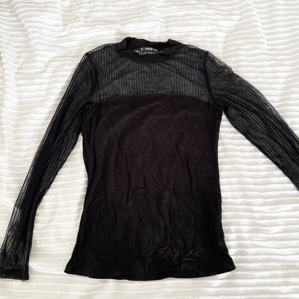 Top with sheer striped neck and sleeve detail.